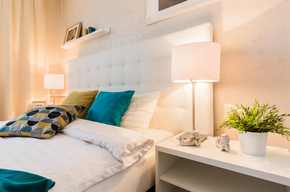 Serene bedroom with warm lighting and calming neutral tones for evening relaxation
